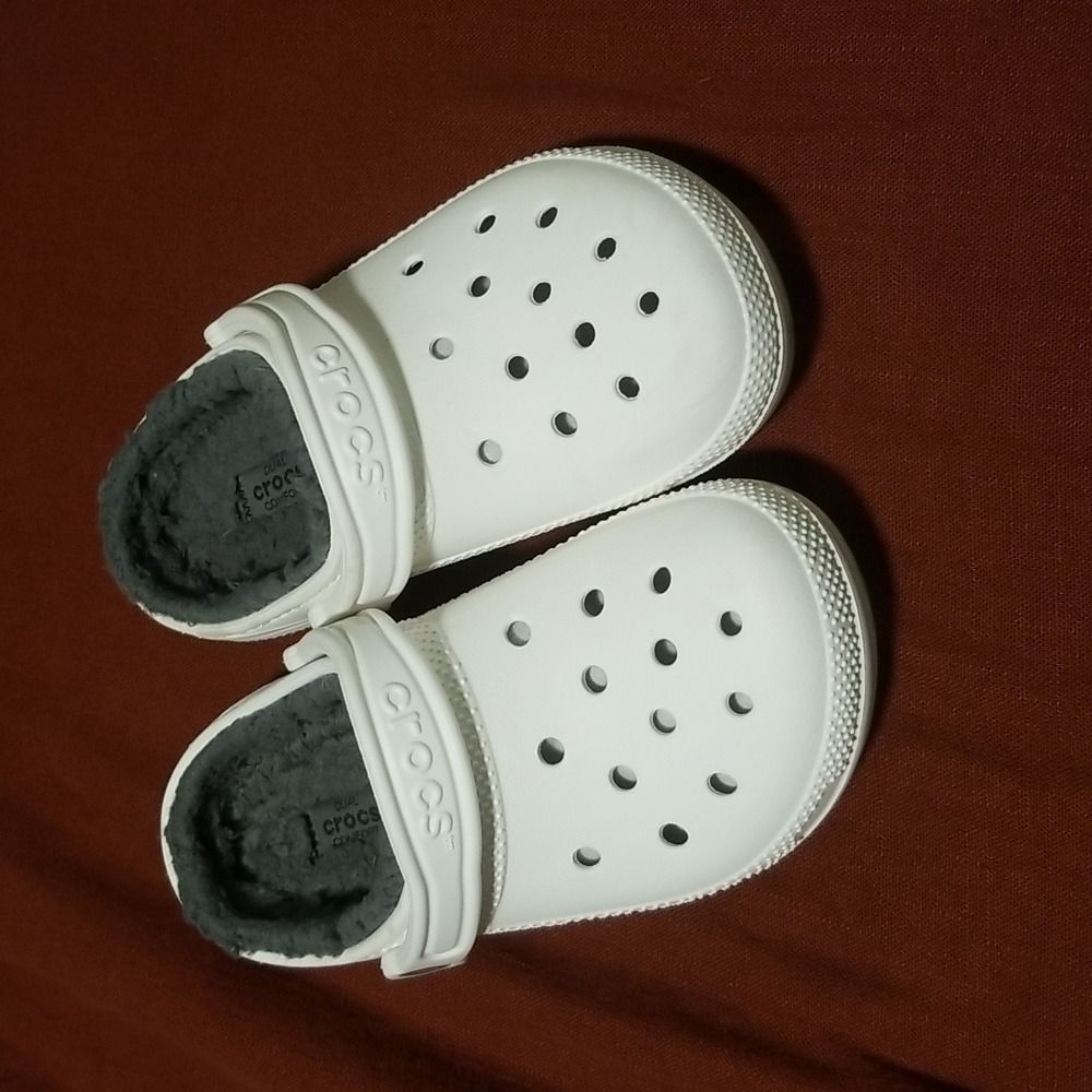 White crocs with grey fur inside